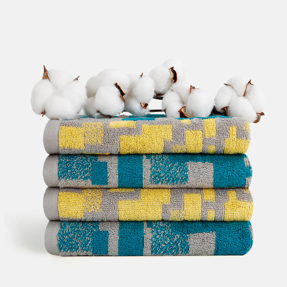 Experience the artistic allure of the SEMAXE Impression Hand Towel Set, featuring four hand towels sized 70x40 cm. These towels are adorned with a minimalist geometric pattern in soothing shades of blue, grey, and yellow, effortlessly adding a touch of modern elegance to any bathroom. Crafted from high-quality cotton, they ensure superior absorbency and softness, perfect for daily use.