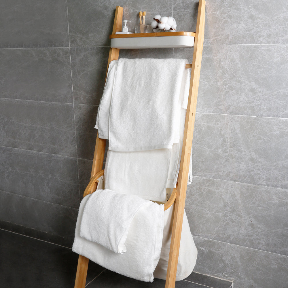 Snow-white towels hang on shelves