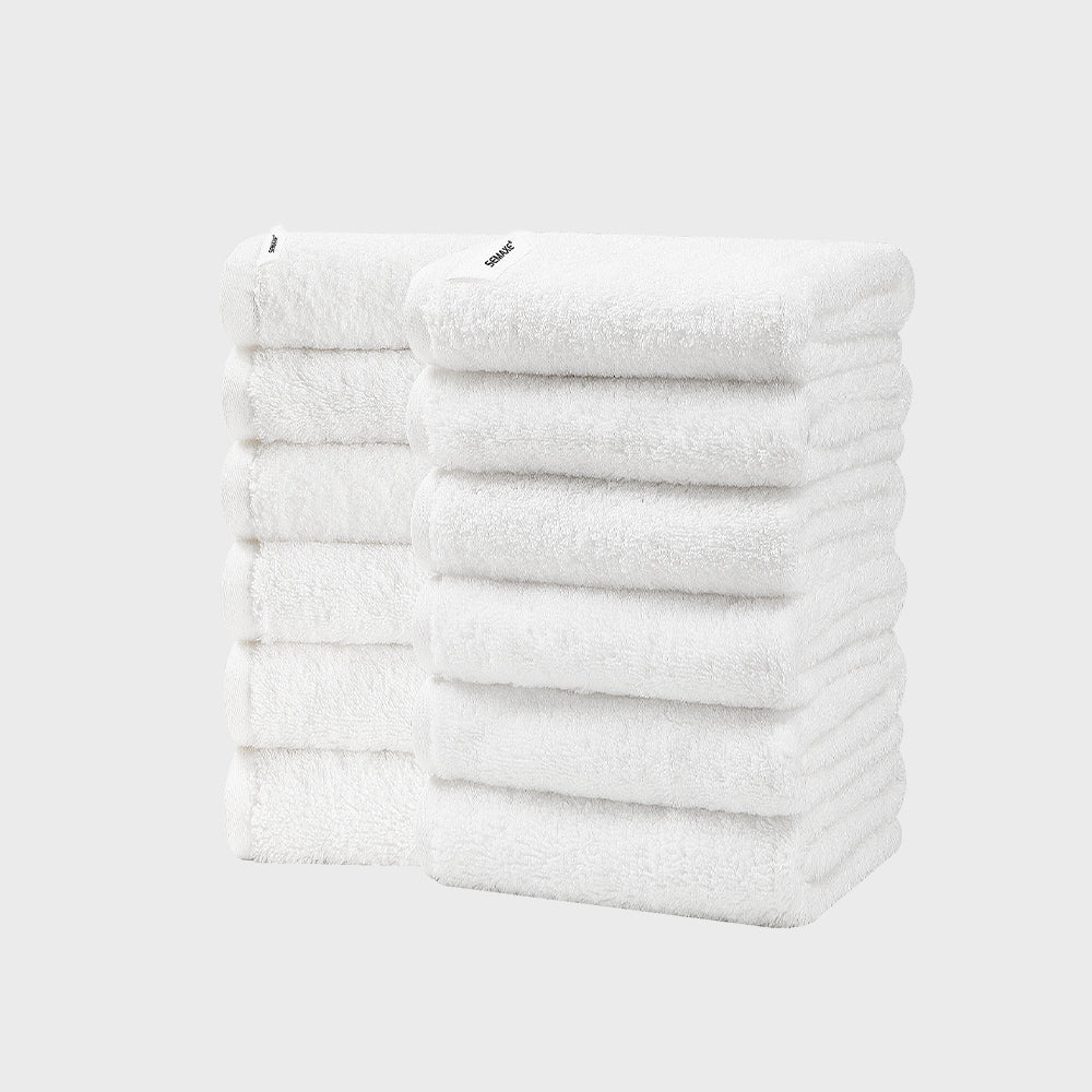 Includes 12 hand towels, each 40cm x 70cm. Classic white towels are a bathroom staple, known for their versatility and clean appearance.