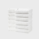 Includes 12 hand towels, each 40cm x 70cm. Classic white towels are a bathroom staple, known for their versatility and clean appearance.