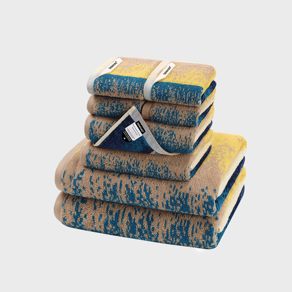 SEMAXE Beach 8-Piece Towel Set with two bath towels, two hand towels, and four washcloths, showcasing serene blue and sandy patterns inspired by the seaside.