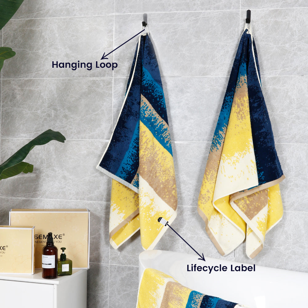 The beach cotton towel is hung on the bathroom wall, revealing its unique pattern, loops and lifecycle labels, inspired by sunny beaches