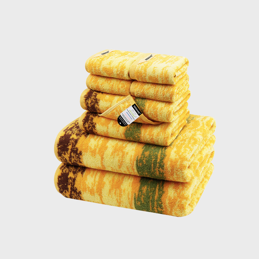 SEMAXE Wheat Field 8-Piece Towel Set, including two bath towels, two hand towels, and four washcloths in golden yellow and earthy brown, evoking a lush wheat field.